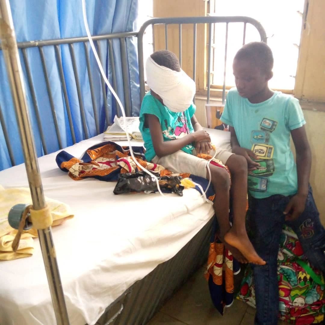 A volunteer visiting and supporting a patient in a care setting
