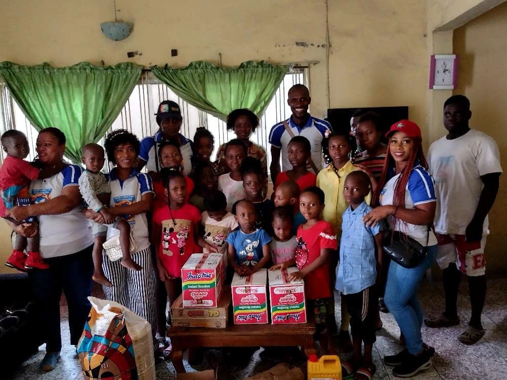 True Christian Volunteers with children and families during a community outreach activity